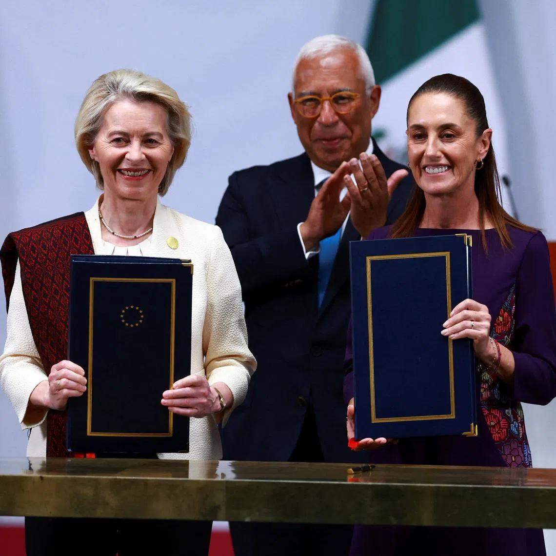 Mexican President Claudia Sheinbaum, European Commission President Ursula von der Leyen and European Council President Antonio Costa pose for a picture as they attend the signing of a long-stalled free trade agreement at the National Palace in Mexico City, Mexico, May 22, 2026. REUTERS/Raquel Cunha