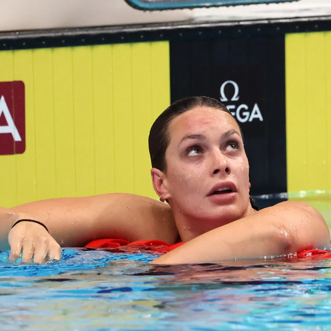 Swimming - FINA World Championships - Budapest, Hungary - June 20, 2022 Canada's Penny Oleksiak reacts after qualifying during the women's 200m freestyle, heat 3 REUTERS/Antonio Bronic