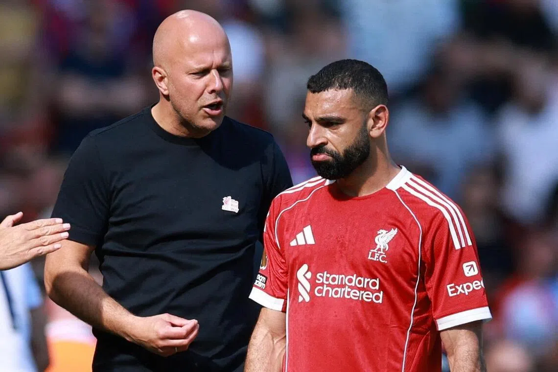 Liverpool manager Arne Slot with Mohamed Salah during a Premier League match against Crystal Palace.