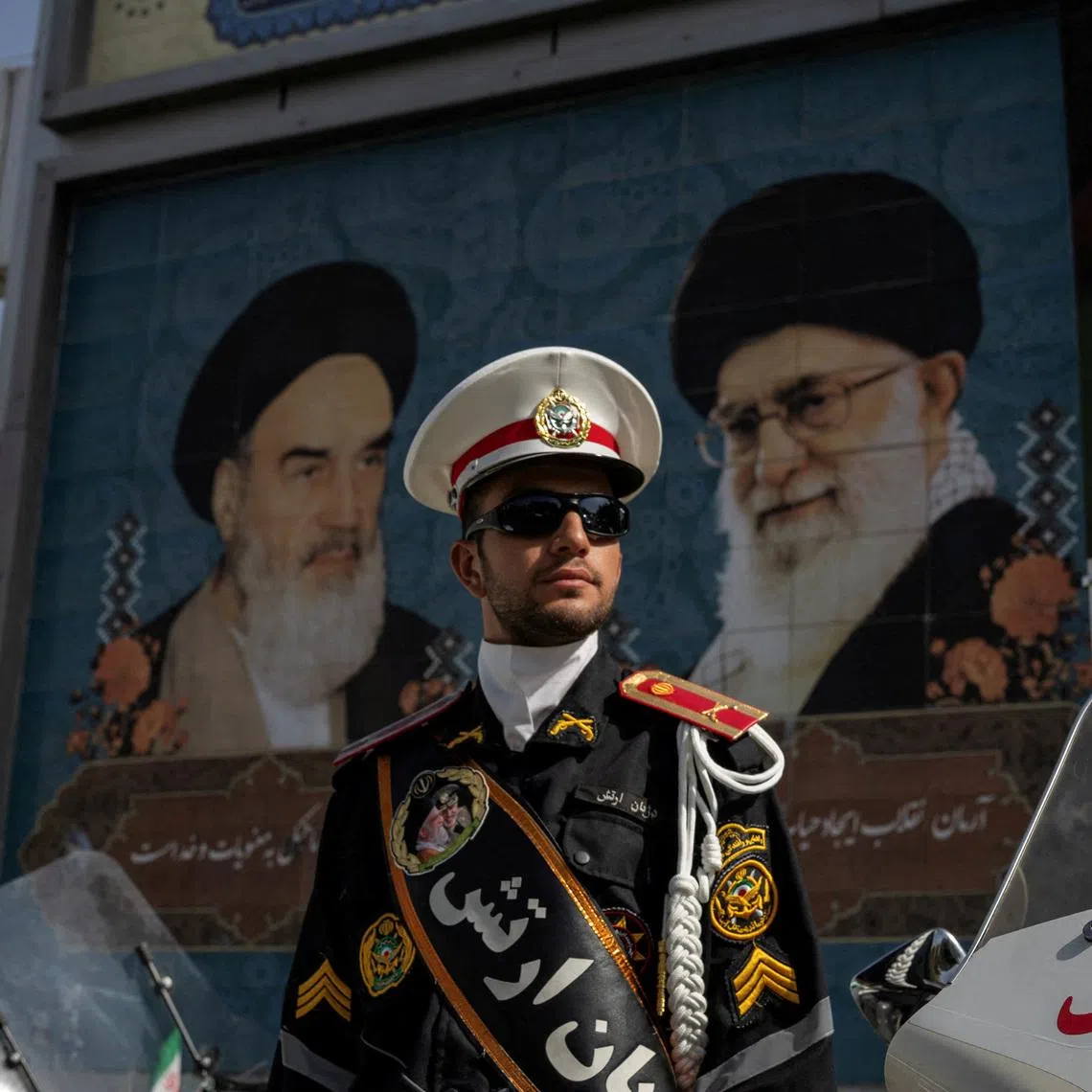 A police officer stands guard at the entrance of the Imam Khomeini Grand Mosalla, where a farewell ceremony for Supreme Leader Ayatollah Ali Khamenei, who was killed on February 28 in Israeli and U.S. airstrikes, takes place, in Tehran, Iran July 3, 2026. REUTERS/Alkis Konstantinidis