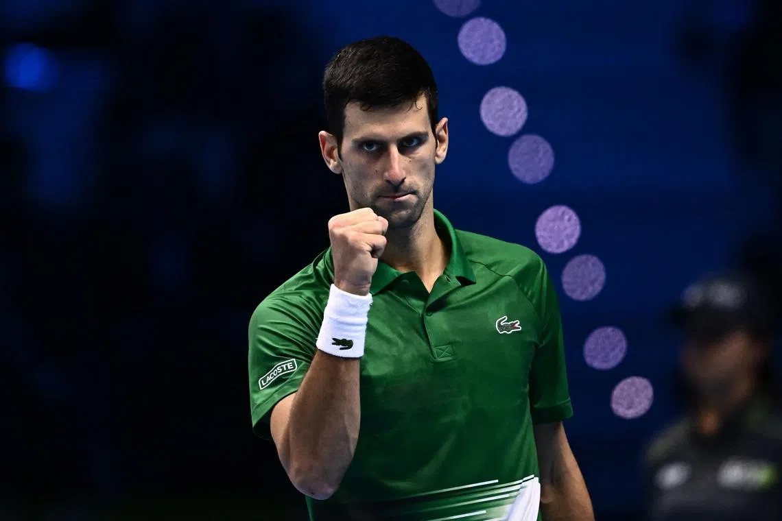 Serbia's Novak Djokovic celebrates winning a point during his round-robin match against Russia's Andrey Rublev on November 16, 2022 at the ATP Finals tennis tournament in Turin. (Photo by Marco BERTORELLO / AFP)