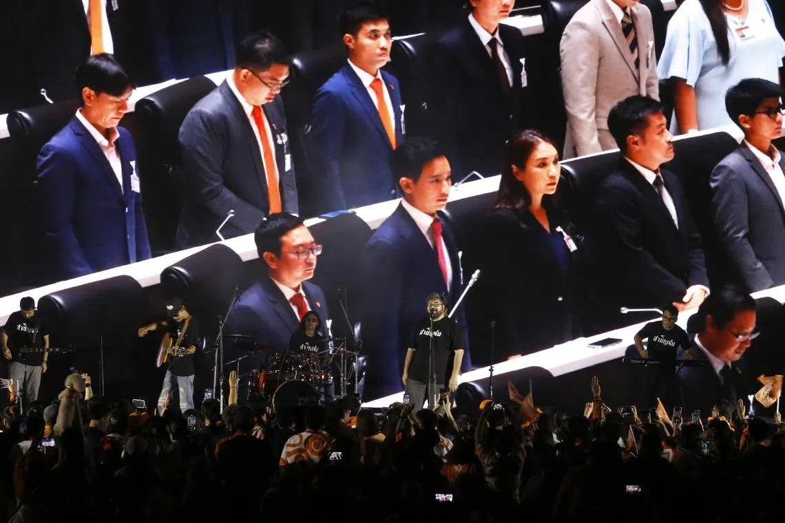epa10880695 A picture of the Move Forward Party's new leader Chaithawat Tulathon (L) next to the party's new chairman of the advisory committee Pita Limjaroenrat (2-L) and other party members is shown on a screen during a meeting with supporters at the party's political rally at the Thai-Japan Bangkok Youth Center in Bangkok, Thailand, 24 September 2023. The Move Forward Party gathered with its supporters after electing Tulathon as their new leader. He will succeed Pita Limjaroenrat, who resigned on 15 September 2023, stating that he could not accept the position of opposition leader. Limjaroenrat will now become the chairperson of the party advisory committee. The Move Forward Party won the majority of seats in the 2023 Thai general election and aims to move forward politically under Tulathon's leadership.  EPA-EFE/NARONG SANGNAK