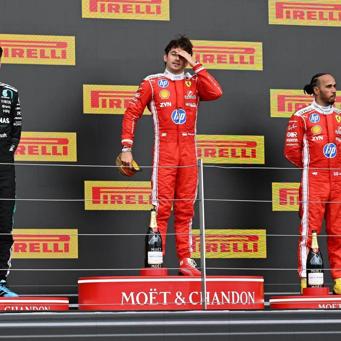 epa13089319 (L-R) Second-placed Mercedes driver George Russell of Britain, first-placed Scuderia Ferrari driver Charles Leclerc of Monaco, and third-placed Scuderia Ferrari driver Lewis Hamilton of Britain celebrate on the podium after the Formula One British Grand Prix at the Silverstone Circuit racetrack in Silverstone, Britain, 05 July 2026.  EPA/PETER POWELL