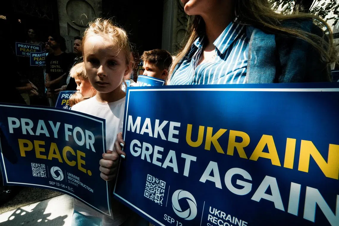 Ukrainians at a rally in New York on Aug 15 ahead of US President Donald Trump’s meeting with his Russian counterpart, Mr Vladimir Putin.