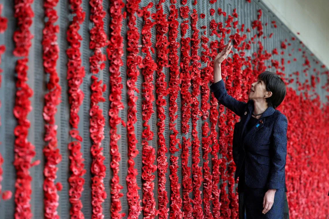 Japan's Prime Minister Sanae Takaichi looking at poppies placed on the First World War Roll of Honour at the Australian War Memorial, in Canberra, Australia, May 4.