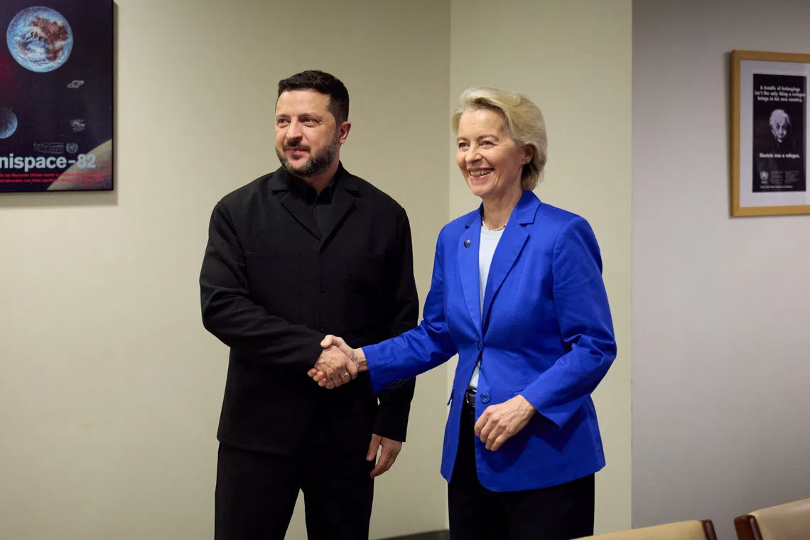 FILE PHOTO: Ukraine's President Volodymyr Zelenskiy and European Commission President Ursula von der Leyen shake hands as they pose for a photo at joint meeting during the 81st United Nations General Assembly, amid Russia's attack on Ukraine, in New York City, US, in this handout picture released September 22, 2026. Ukrainian Presidential Press Service/Handout/File Photo