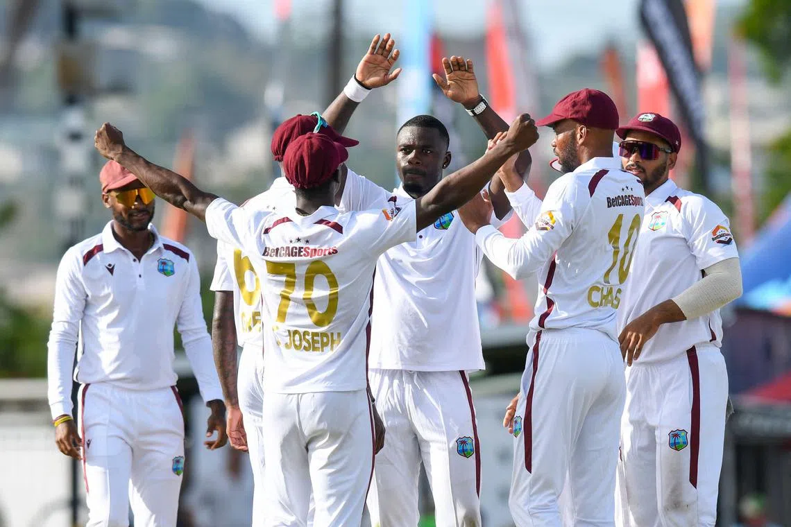Jayden Seales (centre) of West Indies celebrates the dismissal of Australian Josh Inglis on the 2nd day of the first cricket Test at Kensington Oval, Bridgetown, Barbados, on June 26, 2025.