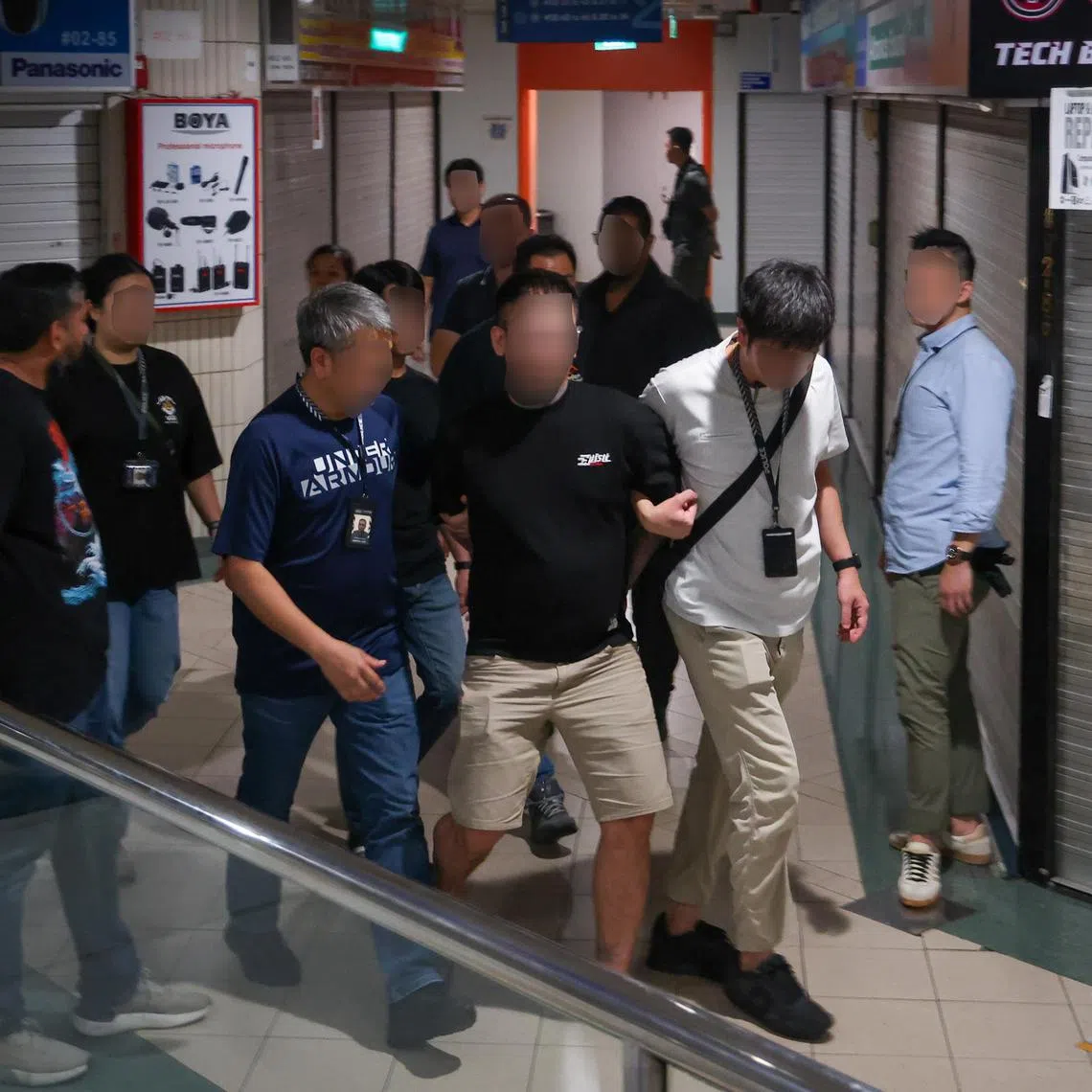 EMBARGOED UNTIL 1500 ON 12 SEP 2025 ST20250911_202502800966/dsraid12/David Sun/Jason Quah/
A man arrested for vape offences during a police raid at Sim Lim Square in the wee hours on Sep 12, 2025. ST PHOTO: JASON QUAH
