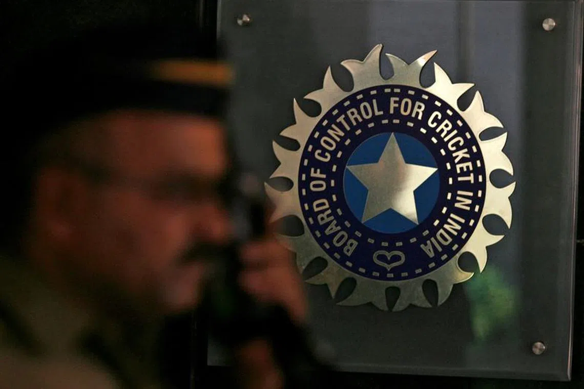 FILE PHOTO: A policeman walks past a logo of the Board of Control for Cricket in India (BCCI) during a governing council meeting of the Indian Premier League (IPL) at BCCI headquarters in Mumbai April 26, 2010. REUTERS/Arko Datta/File Photo