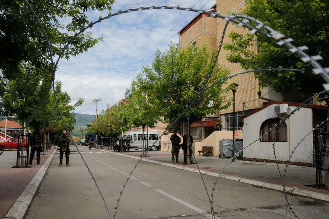 Polish members of the NATO-led Kosovo Force (KFOR) stand guard in Zvecan, Kosovo, June 2, 2023. REUTERS/Ognen Teofilovski/File photo