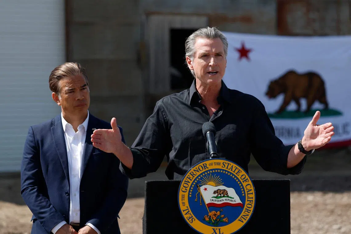 California Governor Gavin Newsom (right) speaking on April 16, as California Attorney-General Rob Bonta looks on, during a news conference in Ceres, California.