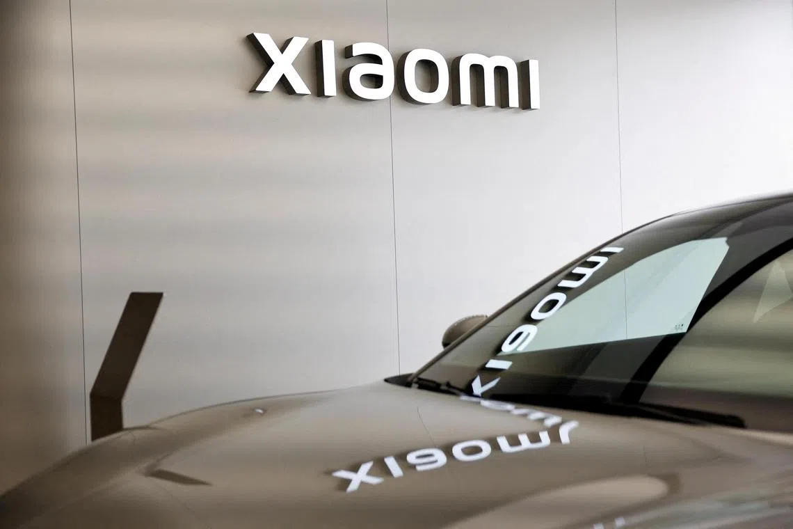 FILE PHOTO: Xiaomi's first electric vehicle SU7 is displayed at a showroom of a newly opened Xiaomi store in Beijing, China March 25, 2024. REUTERS/Tingshu Wang/File Photo