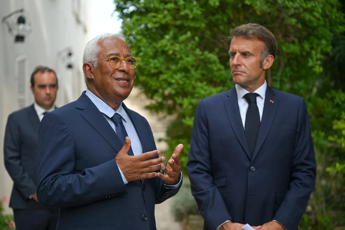 FILE PHOTO: Antonio Costa, President of the European Council talks near French President Emmanuel Macron after an online meeting with other European leaders where they discussed the ongoing war in Ukraine, at Fort de Bregancon in Bormes-les-Mimosas, France, 13 August 2025.  PHILIPPE MAGONI/Pool via Reuters/FIle Photo