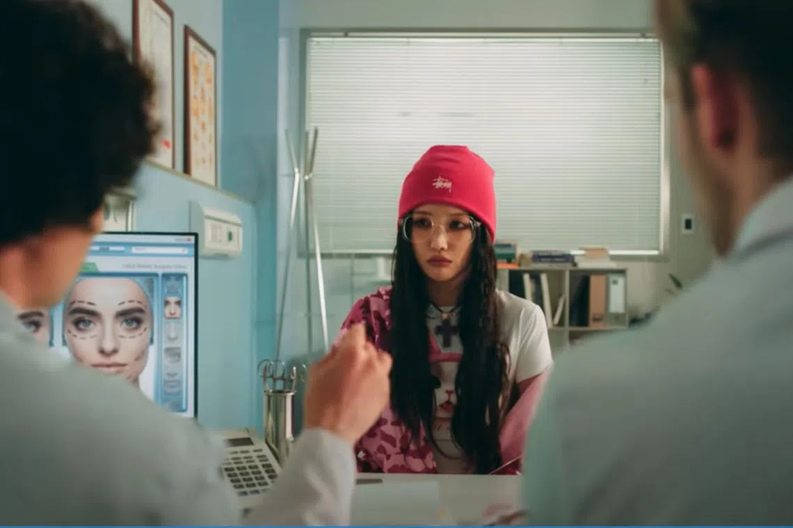 (G)I-DLE member Soyeon plays a girl contemplating plastic surgery in her group's new music video Allergy.