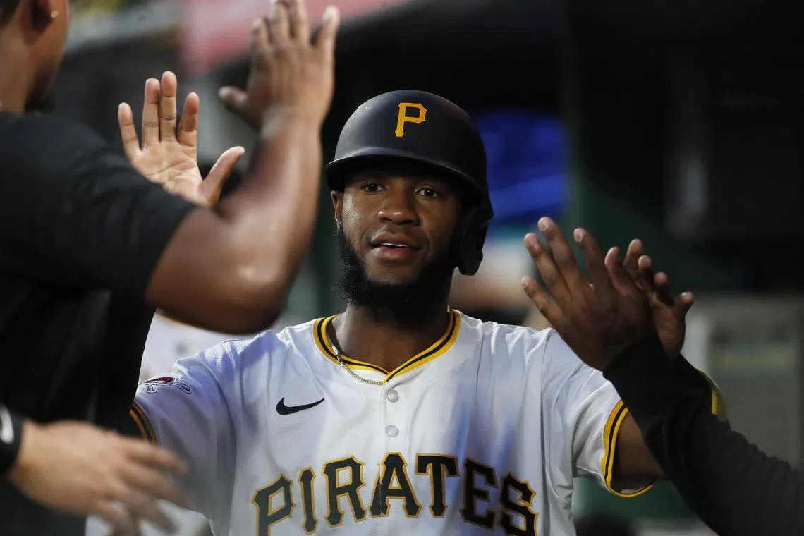 FILE PHOTO: Sep 24, 2024; Pittsburgh, Pennsylvania, USA; Pittsburgh Pirates right fielder Bryan De La Cruz (41) celebrates with teammates in the dugout after scoring a run against the Milwaukee Brewers  during the second inning at PNC Park. Mandatory Credit: Charles LeClaire-Imagn Images/File Photo