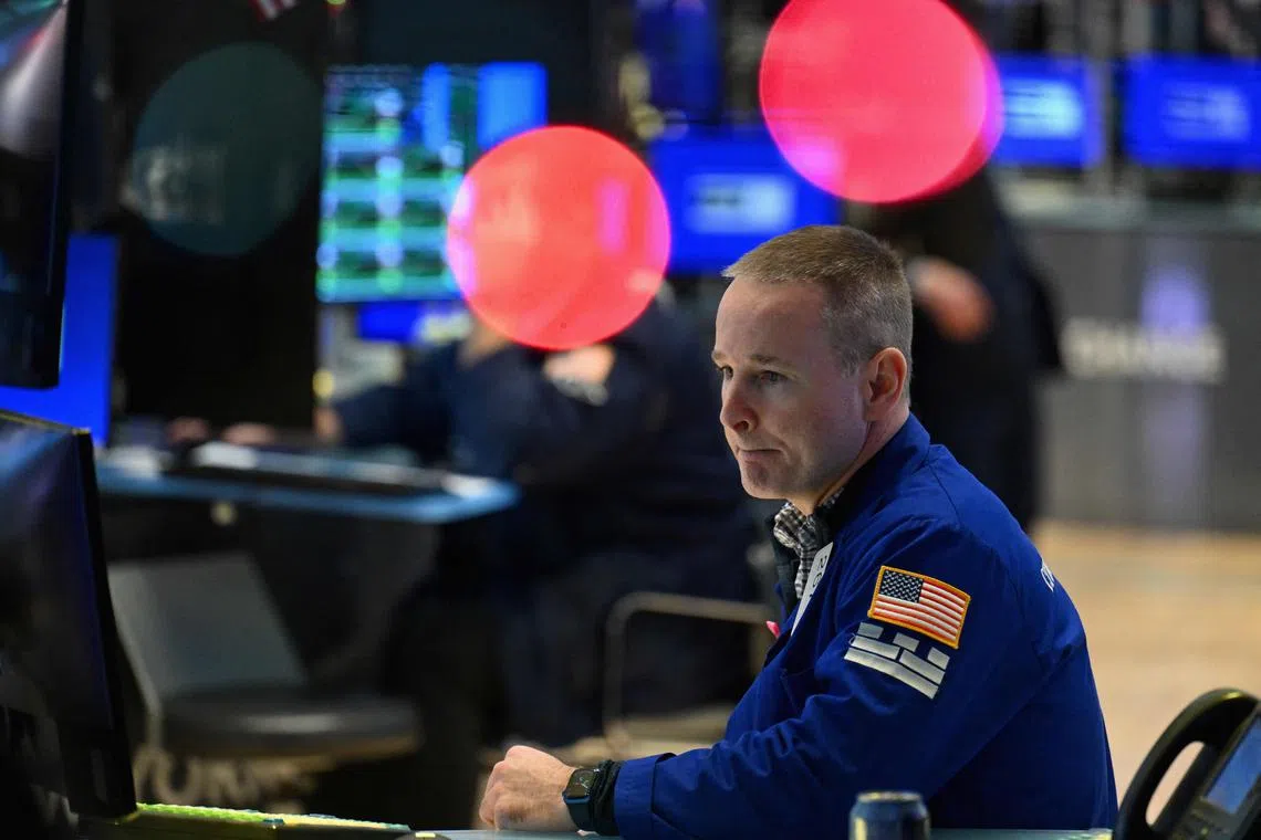 Traders work on the floor of the New York Stock Exchange, in New York City. 
