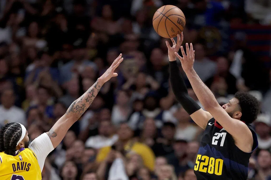Jamal Murray of the Denver Nuggets puts up a last-second shot against Anthony Davis in the fourth quarter to defeat the Los Angeles Lakers during Game 2 of the NBA Western Conference first-round play-offs.