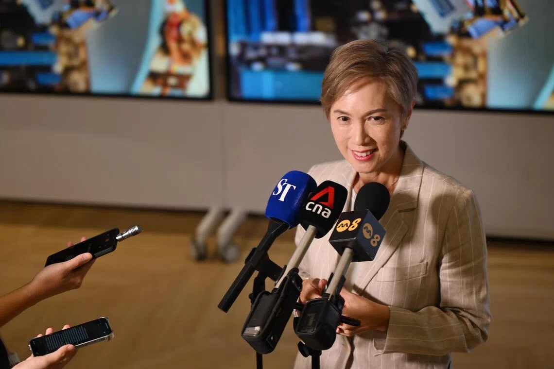 Minister for Digital Development and Information Josephine Teo speaking to the media after a tour of the UBS AI and Transformation Factory, its largest and first, on Oct 6, 2025.

ST PHOTO: AZMI ATHNI