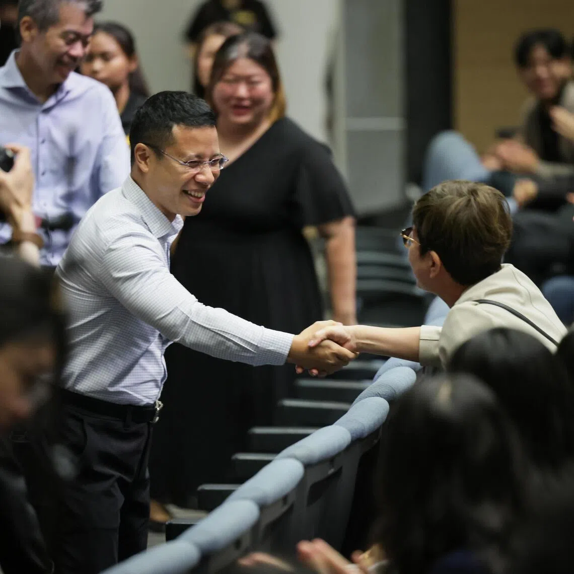 Mr Desmond Lee, Minister for Education in a handshake with a attendee at the Polytechnic Forum 2025 held in Singapore Polytechnic Convention Centre on Sep 15, 2025.