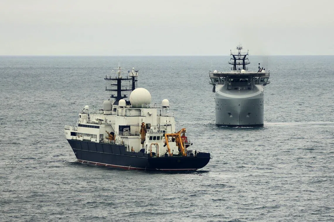 A Britain Ministry of Defence photo shows the Royal Navy vessel Proteus (right) patrolling near the Russian vessel Yantar, in November 2024.