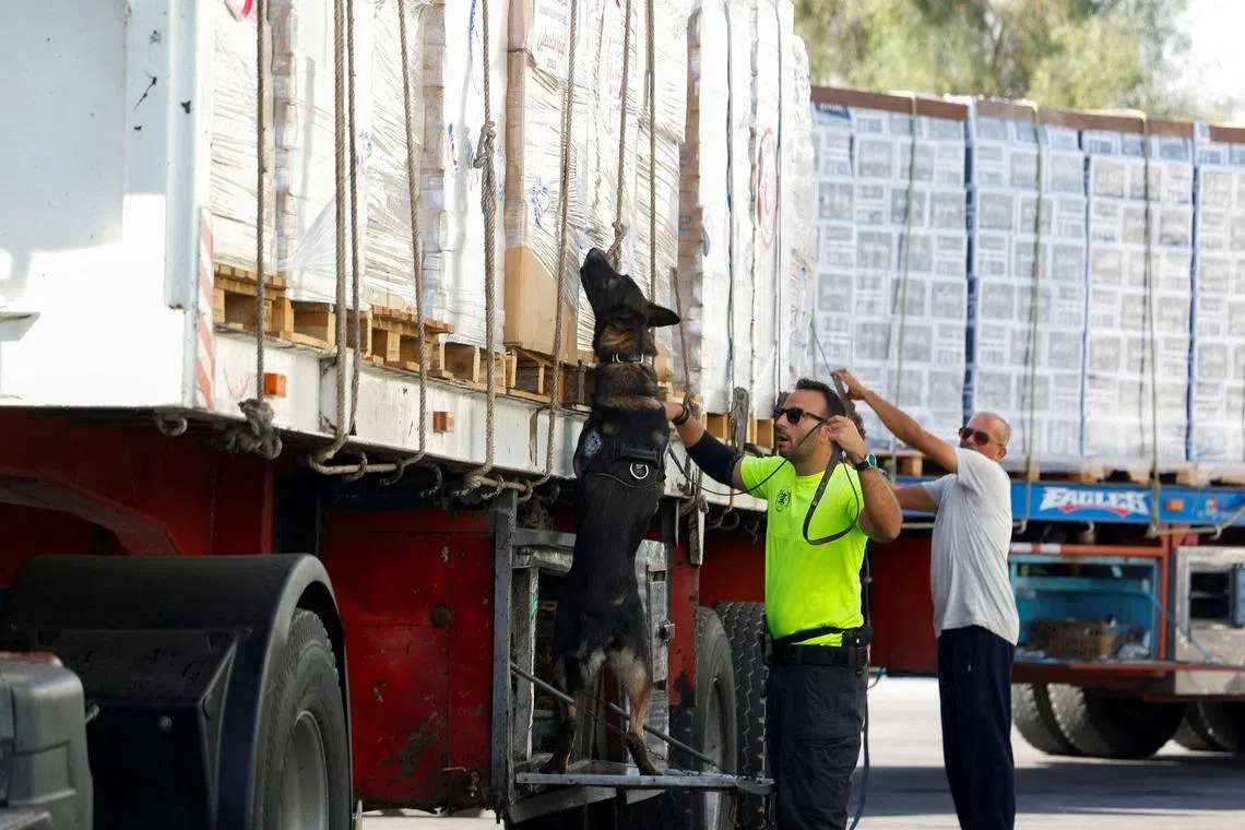 A truck with humanitarian supplies bound for Gaza is being inspected at the Nitzana border crossing in Israel, on Nov 9.