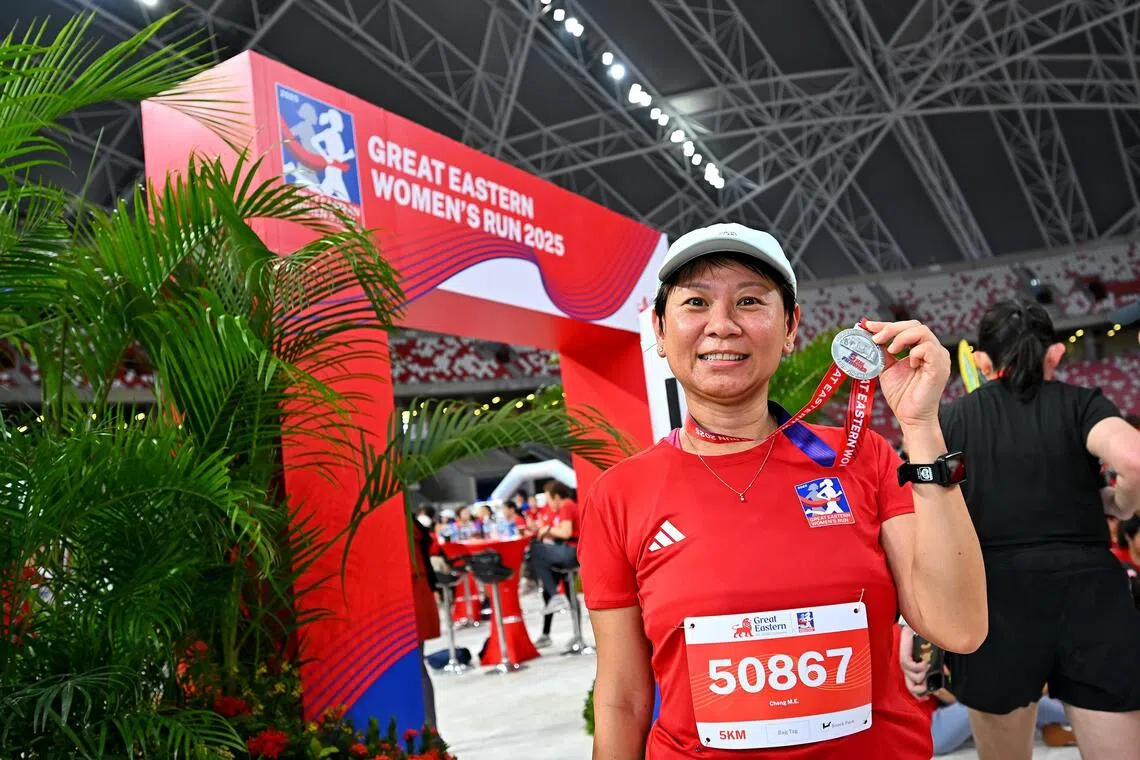 jcrun09 - Mdm Cheng Meow Eng posing with her medal after completing the 5km run at the Great Eastern Women's Run 2025.
Credit: GREAT EASTERN