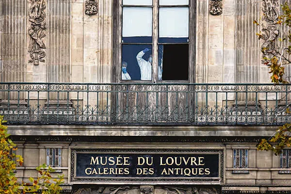 A forensic team inspecting a window believed to have been used in the Louvre heist on Oct 19.