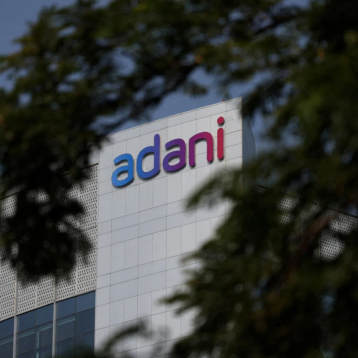 FILE PHOTO: The logo of the Adani Group is seen on the facade of its Corporate House on the outskirts of Ahmedabad, India, November 21, 2024. REUTERS/Amit Dave/File Photo/File Photo