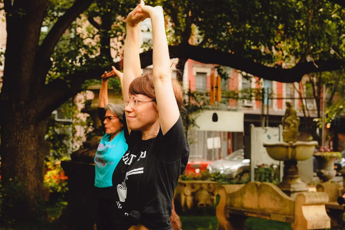 A morning taiji class at Elizabeth Street Garden in New York, on Sunday, June 11, 2023. Decades of research have established that movement has a positive effect on mental health. 