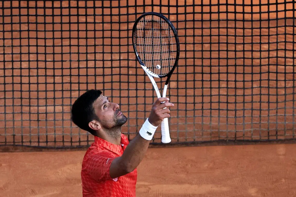 Djokovic celebrates after winning against Ivan Gakhov in Monaco.