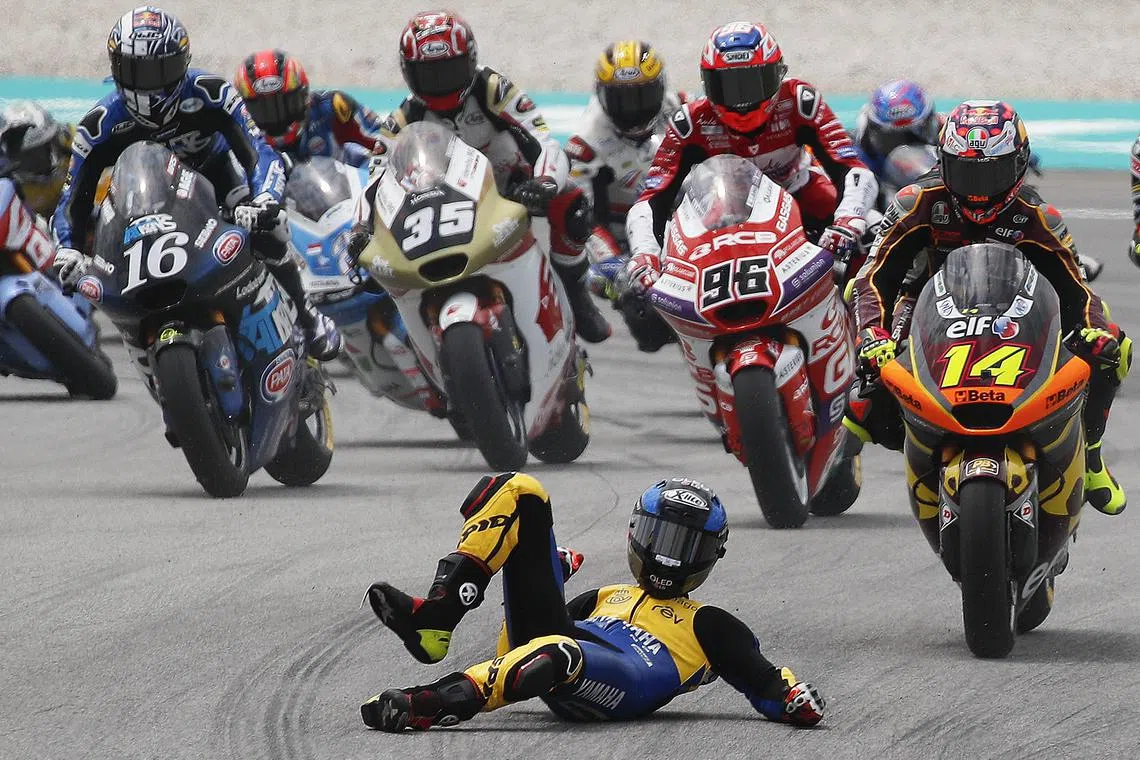 Spanish rider Manuel Gonzalez of Correos Prepago Yamaha VR46 Team falling during the Moto2 class race of the Malaysia Motorcycling Grand Prix 2023 in Petronas Sepang International Circuit, Malaysia on Nov 12, 2023.  