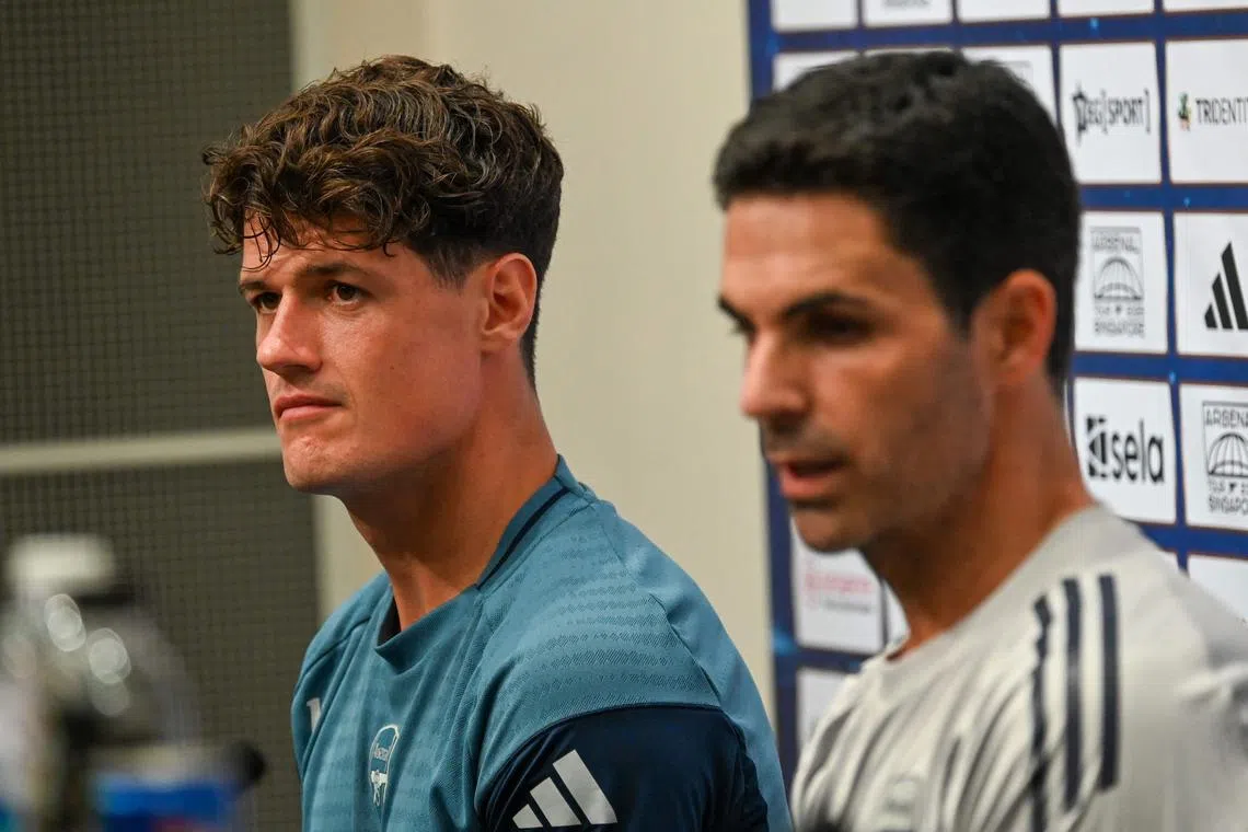 Arsenal’s Spanish manager Mikel Arteta (R) and Arsenal’s Christian Norgaard attend a pre-match press conference ahead of their football match against Newcastle United at the National Stadium in Singapore on July 25, 2025. (Photo by Roslan RAHMAN / AFP)