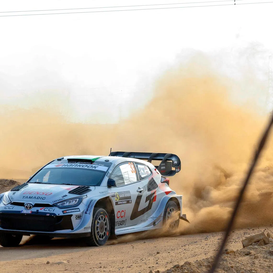 Toyota Gazoo Racing WRT Team's British driver Elfyn Evans and co-driver Scott Martin in their Toyota GR Yaris Rally 1 during the second stage of the FIA World Rally Championship (WRC) in Jeddah on Nov 27, 2025.
