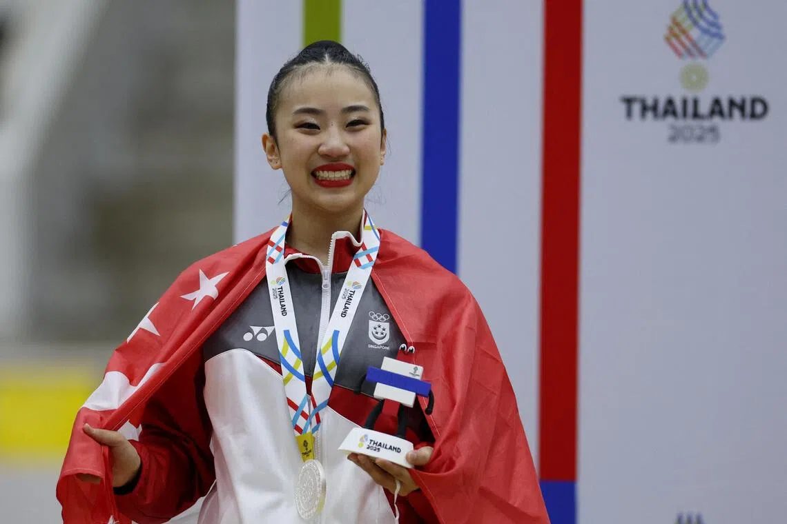 Southeast Asian Games - SEA - Gymnastics - Thammasat University Rangsit Campus, Pathum Thani, Thailand - December 16, 2025
Silver medallist Singapore's Mikayla Angeline Yang celebrates during the rhythmic gymnastics individual all around medal ceremony REUTERS/Chalinee Thirasupa
