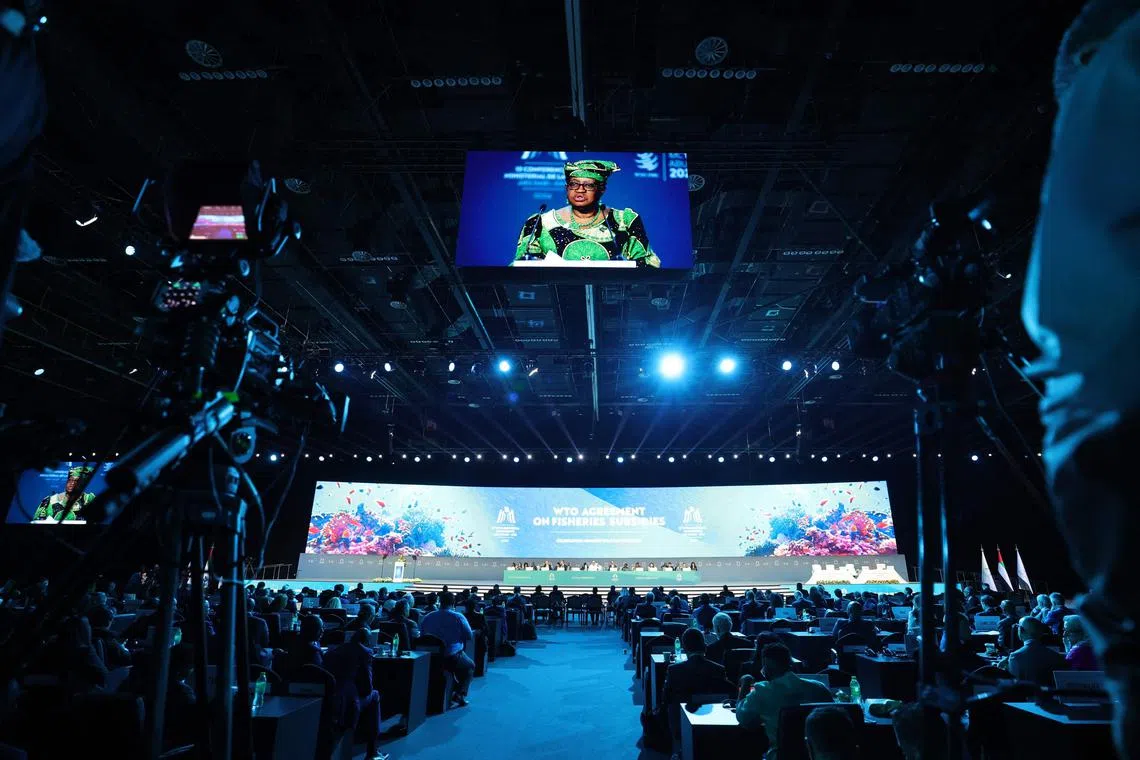 TOPSHOT - Director-General of the World Trade Organization (WTO) Ngozi Okonjo-Iweala addresses delegates during a session on fisheries subsidies during the 13th WTO Ministerial Conference in Abu Dhabi of February 26, 2024. The world's trade ministers gathered in the UAE on February 26 for a high-level WTO meeting with no clear prospects for breakthroughs, amid geopolitical tensions and disagreements. (Photo by Giuseppe CACACE / AFP)