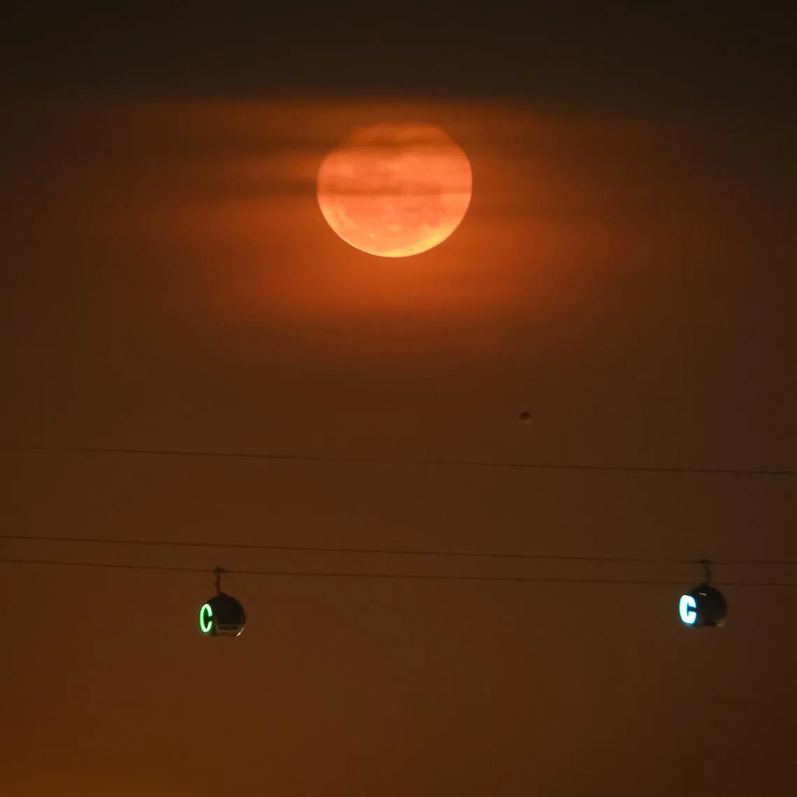 PIXGENERIC A waning gibbous moon rises over the eastern horizon above HarbourFront on May 4, 2026.