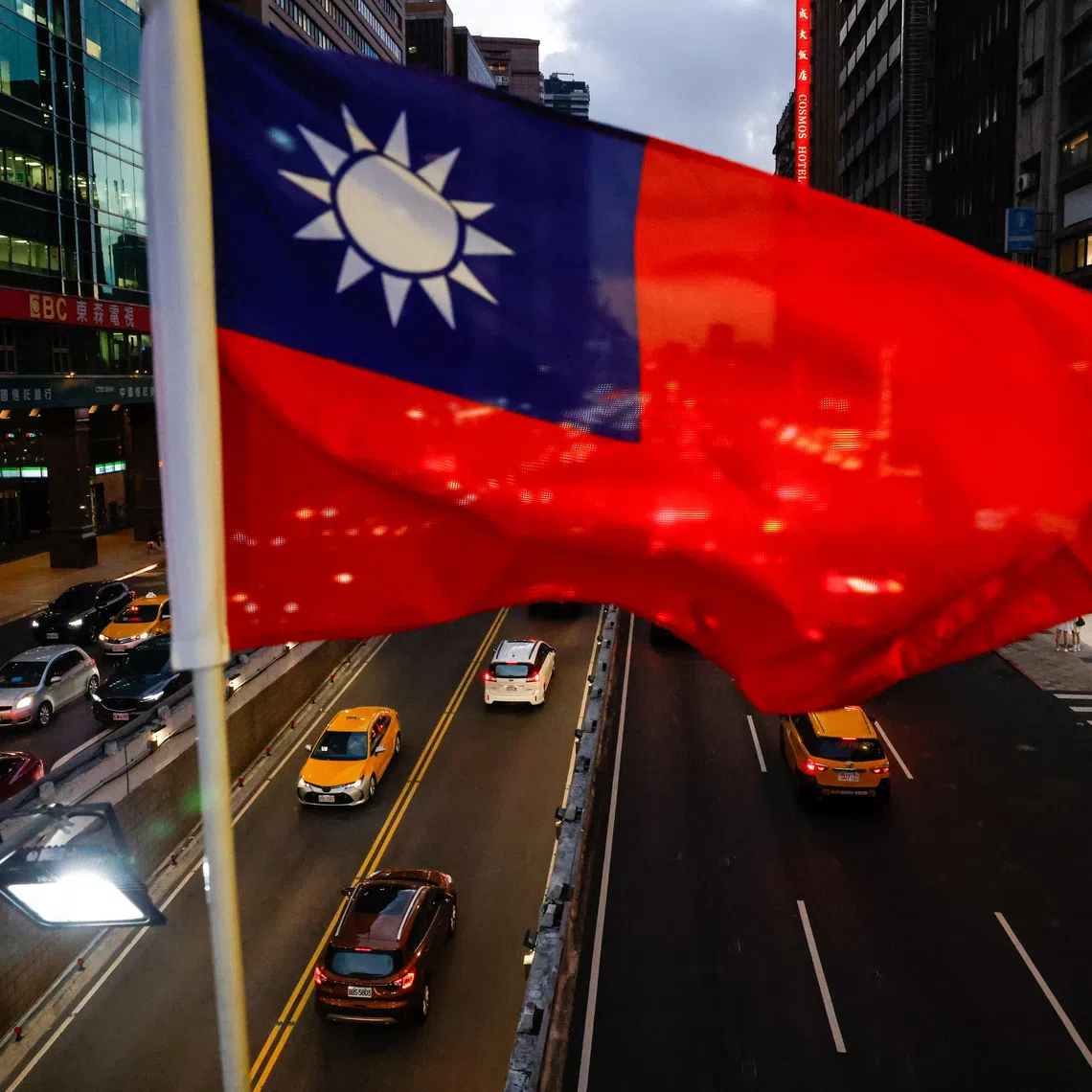 A Taiwan flag can be seen on an overpass ahead of National Day celebrations in Taipei, Taiwan, October 8, 2025. REUTERS/Ann Wang