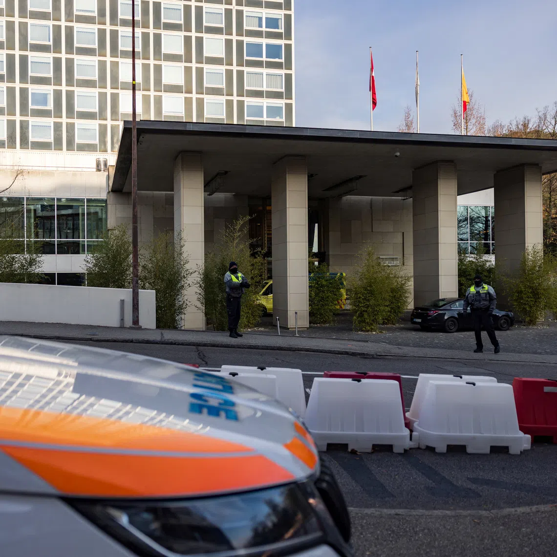 Diplomatic security officers secure the entrance of the InterContinental hotel as U.S. and Ukrainian officials prepare for closed-door talks..