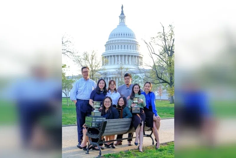 The winning team from the Singapore Management University with the trophy in Washington DC. 