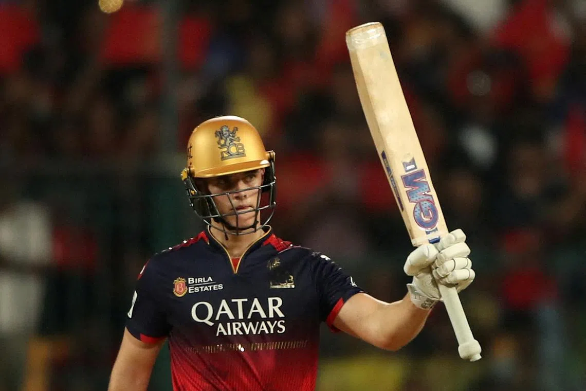 FILE PHOTO: Cricket - Indian Premier League - IPL - Royal Challengers Bengaluru v Chennai Super Kings - M. Chinnaswamy Stadium, Bengaluru, India - May 3, 2025 Royal Challengers Bengaluru' Jacob Bethell celebrates after reaching his half century REUTERS/Stringer/File Photo