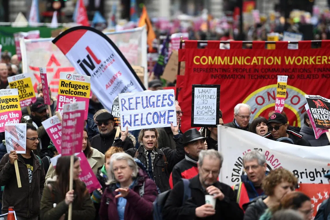 Around 2,000 people, many carrying signs bearing trade union logos, marched in London against the Bill.