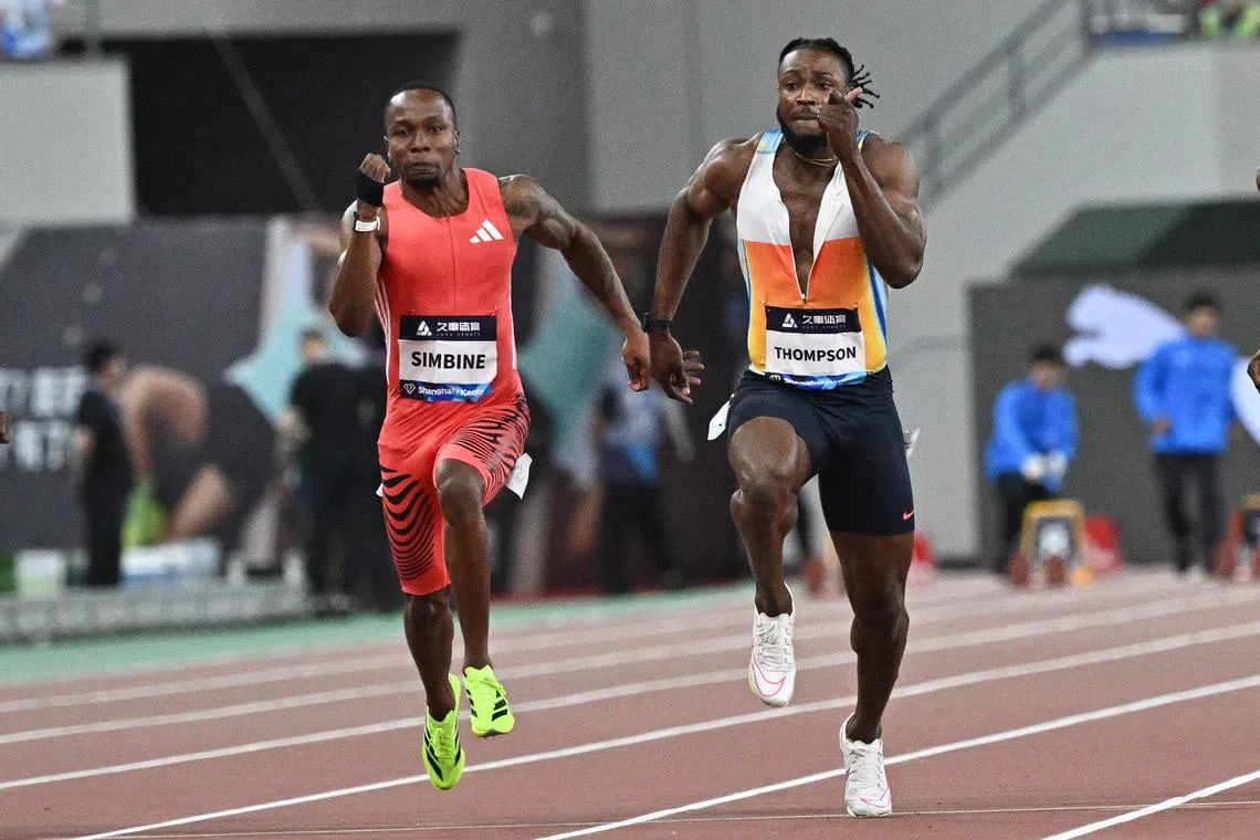 South Africa's Akani Simbine and Jamaica's Kishane Thompson compete in men's 100m during the Shanghai/Keqiao Diamond League meet.