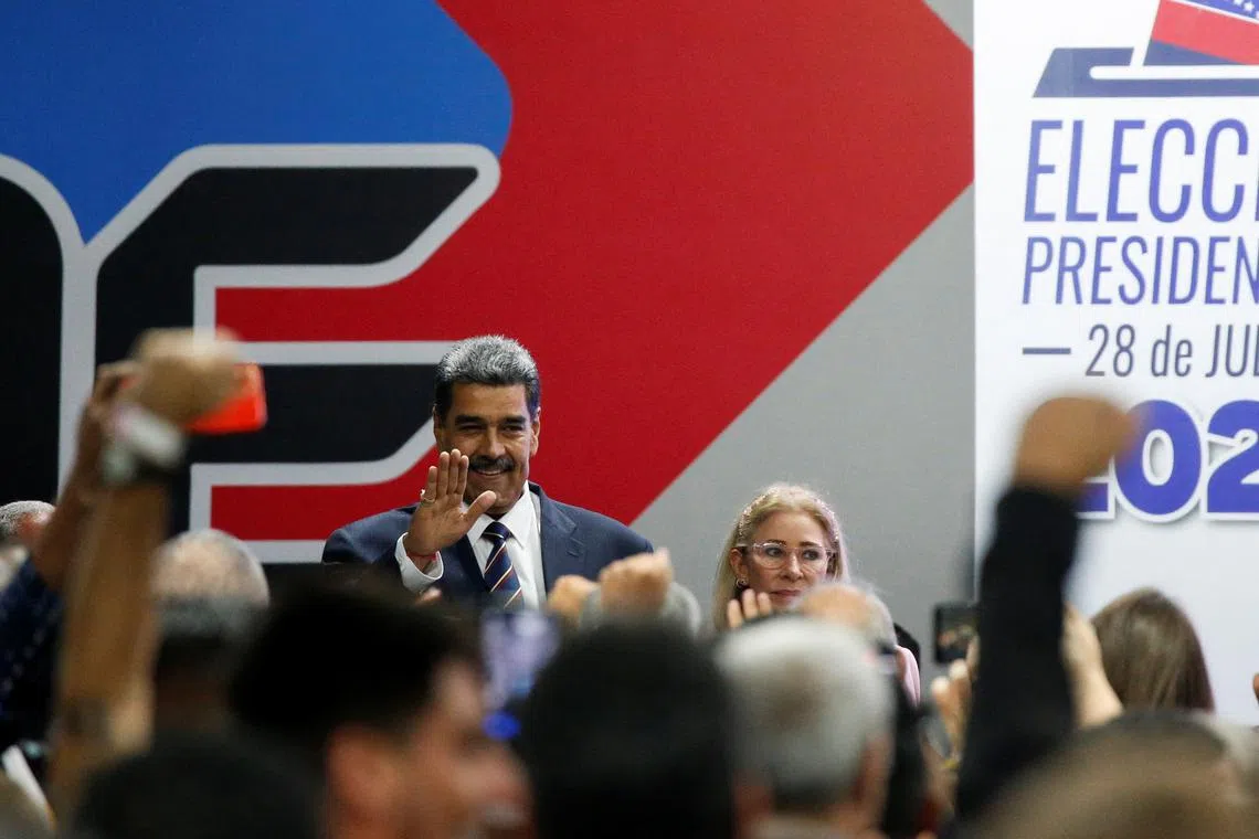 Venezuela's President Nicolas Maduro waves as he attends an event at the National Electoral Council (CNE) to be proclaimed as winner of the country's presidential election, in Caracas, Venezuela July 29, 2024. REUTERS/Leonardo Fernandez Viloria