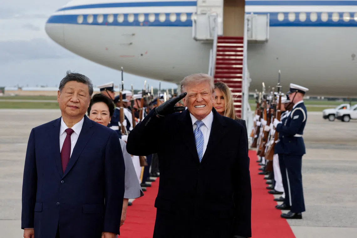 US President Donald Trump reacts to the roar of B-1 bomber flyover during the U.S. national anthem as Trump salutes next to Chinese President Xi Jinping during an arrival ceremony ahead of a state visit at Joint Base Andrews, Maryland, US, September 23, 2026. REUTERS/Jonathan Ernst TPX IMAGES OF THE DAY