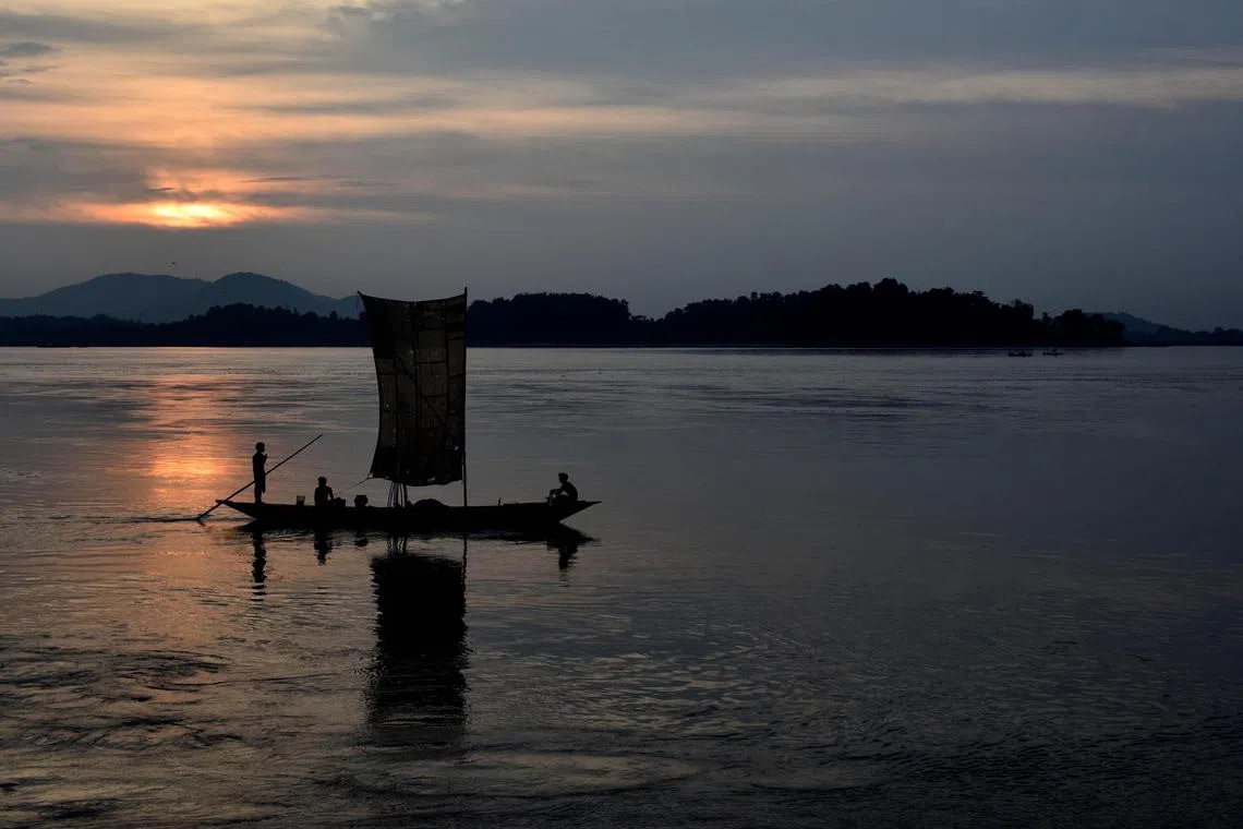 ddarunachaldam// Indian fishermen paddle their down the Brahmaputra River during sunset in Guwahati on August 6, 2015. The Brahmaputra originates in Tibet, where it is known as the Yarlung Zangbo it enters India as the Siang and then onto the Bay of Bangal through Bangladesh as the Jamuna. Fishing provides a livelihood for hundreds of thousands who live along the banks of the river.