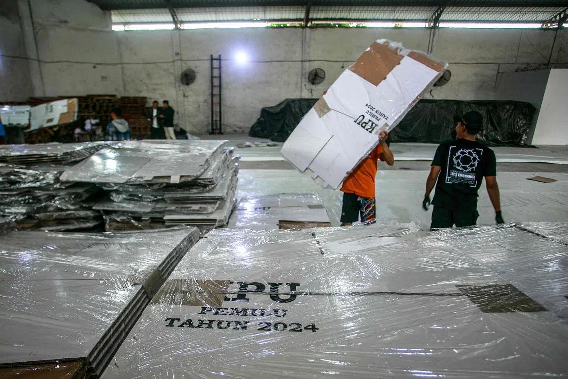 Workers arranging ballot boxes at a warehouse of Indonesia's General Elections Commission in Yogyakarta on Nov 3.