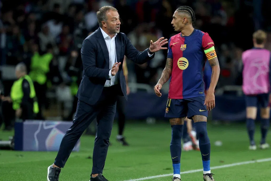 Barcelona coach Hansi Flick giving instructions to Raphinha during their 4-1 Champions League win over Bayern Munich.