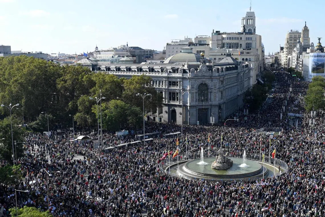 Hundreds of thousands of protesters gather at the Cibeles square during a demonstration in Madrid on Nov 13, 2022.
