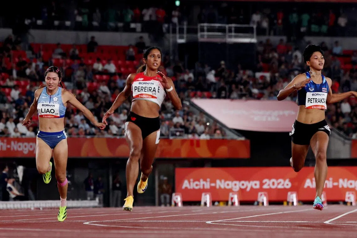 Asian Games - Aichi-Nagoya 2026 - Athletics - Paloma Mizuho Sports Park, Nagoya, Japan - September 25, 2026
Singapore's Shanti Pereira  in action with Taiwan's Yan-jun Liao and Thailand's Sukanda Petraksa during the Women's 100m Semi Final Heat 1 REUTERS/Chalinee Thirasupa