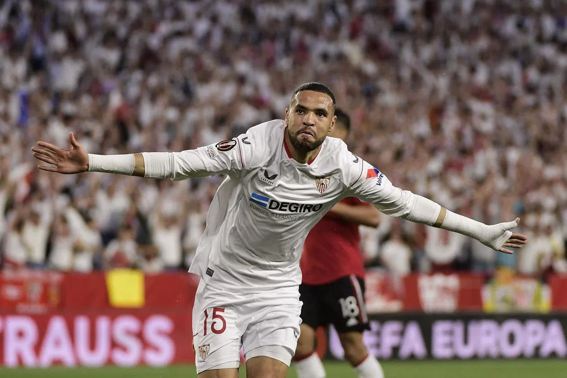 Sevilla's Moroccan forward Youssef En-Nesyri celebrates after scoring his team's first goal.